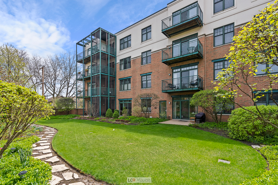 140 North Euclid Avenue, Unit 202 Oak Park, IL 60302 - Photo 12 of 15 a view of a building with a yard