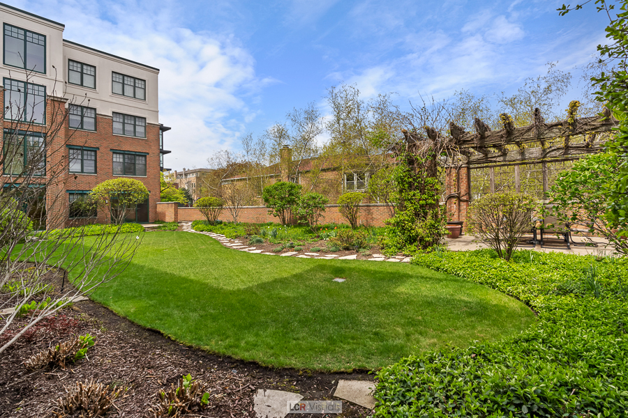 140 North Euclid Avenue, Unit 202 Oak Park, IL 60302 - Photo 13 of 15 a view of a building with a yard