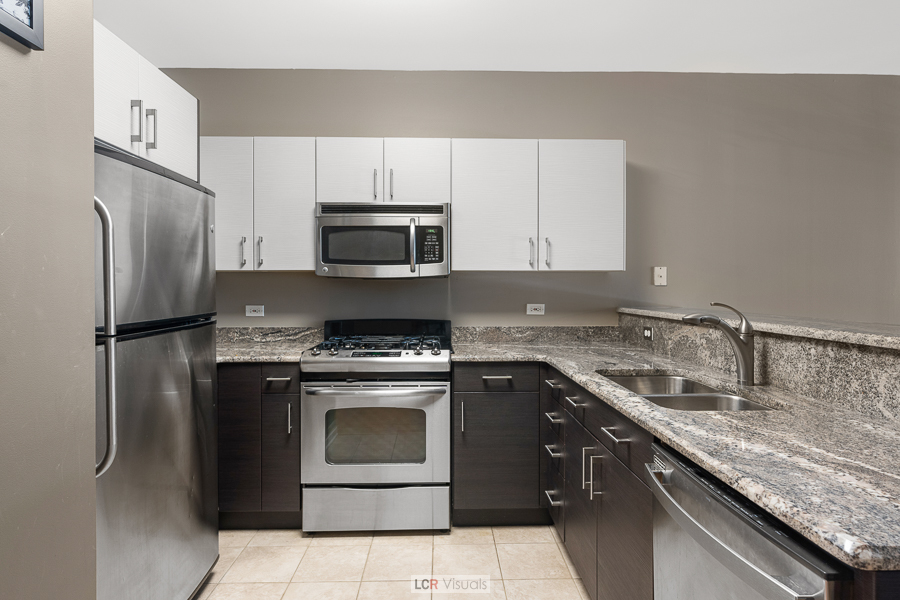 140 North Euclid Avenue, Unit 202 Oak Park, IL 60302 - Photo 4 of 15 a kitchen with a sink stove and refrigerator