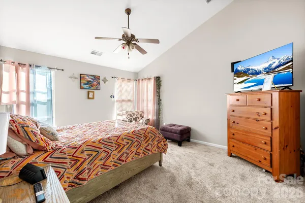 a bedroom with a bed and closet