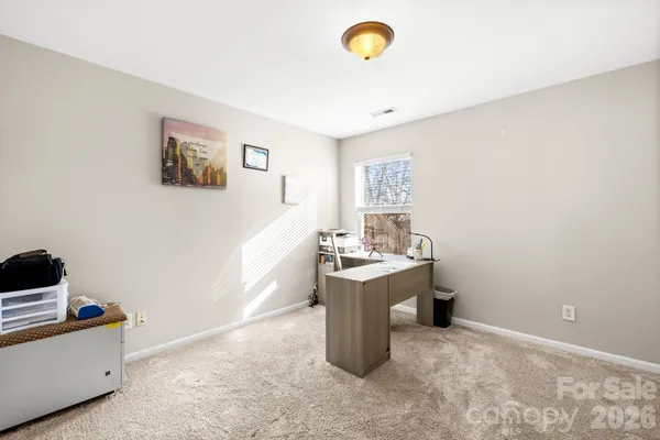 a view of a storage & utility room with a window