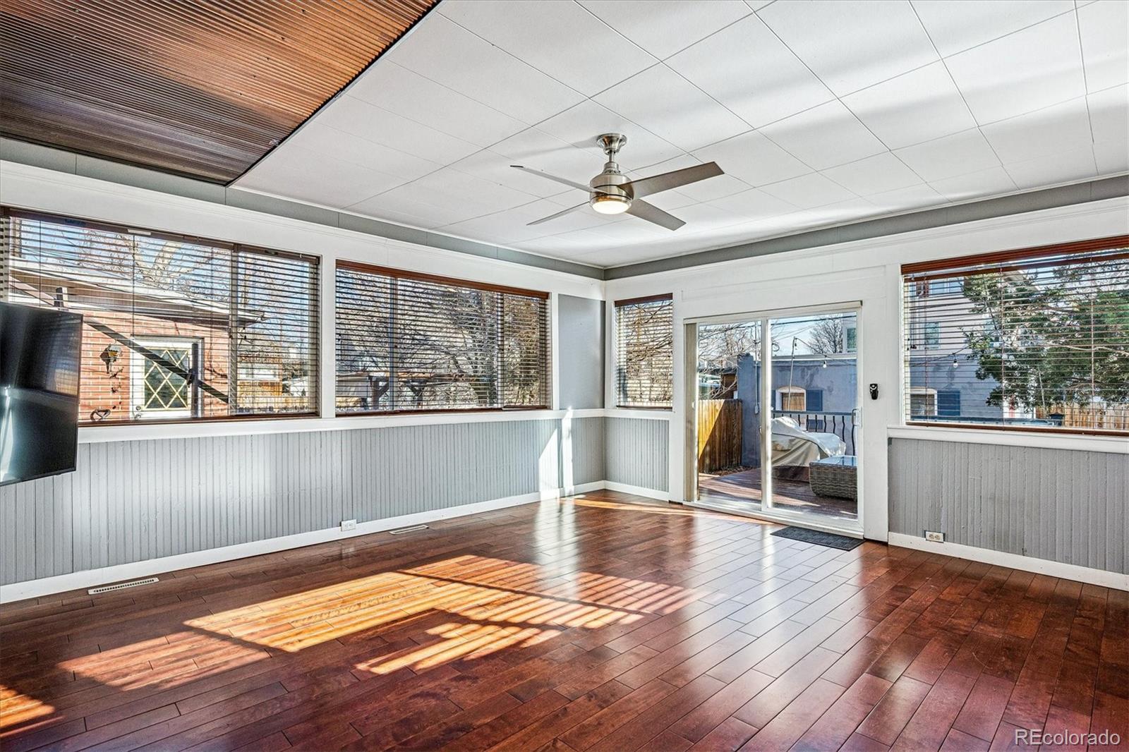 354 North Washington Street Denver, CO 80203 - Photo 20 of 43 a view of an empty room with wooden floor and a window