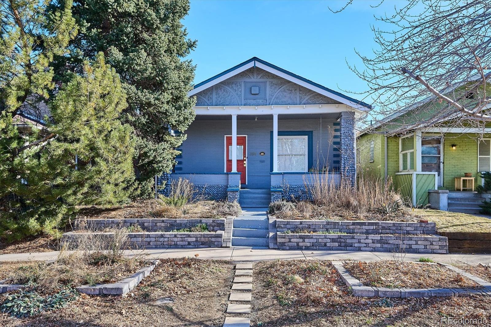 354 North Washington Street Denver, CO 80203 - Photo 2 of 43 a front view of a house with garden