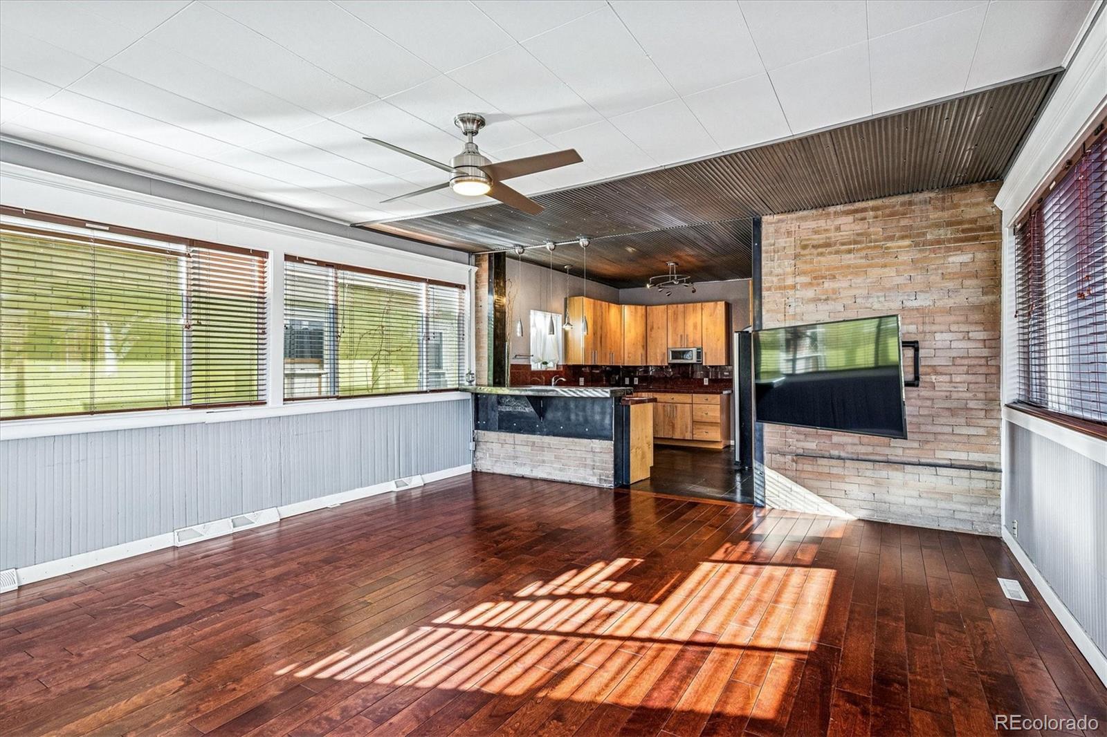 354 North Washington Street Denver, CO 80203 - Photo 22 of 43 a living room with furniture and a large window