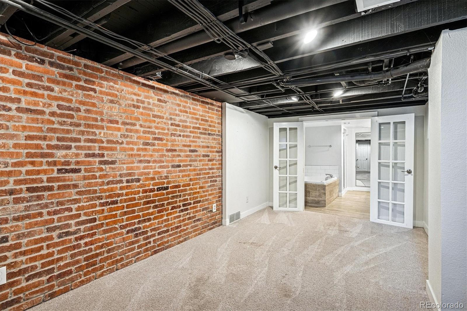 354 North Washington Street Denver, CO 80203 - Photo 28 of 43 a view of empty room with wooden walls