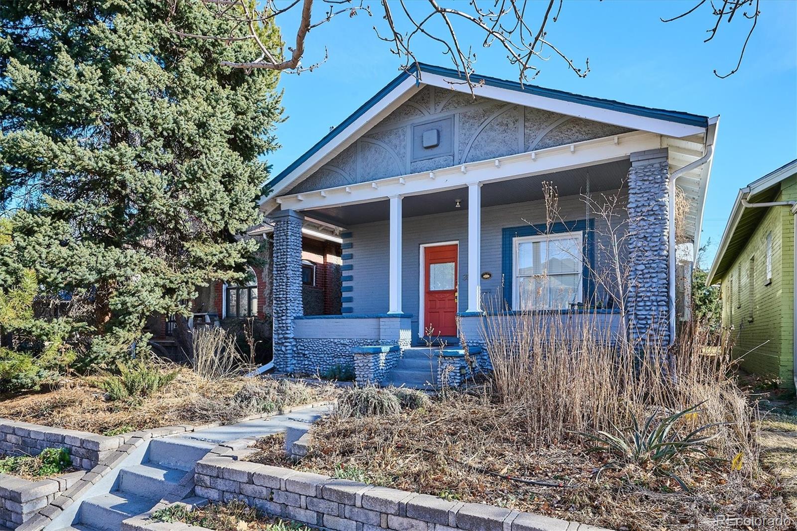 354 North Washington Street Denver, CO 80203 - Photo 3 of 43 a front view of a house with garden