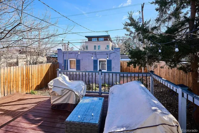 a view of a wooden deck with furniture