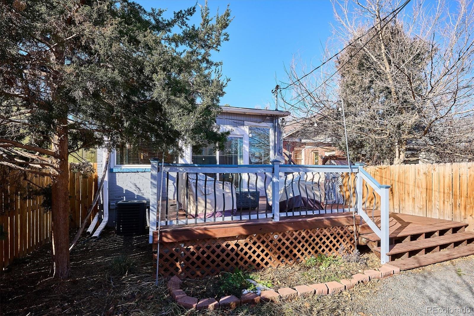 354 North Washington Street Denver, CO 80203 - Photo 40 of 43 a view of a wooden deck with a bench and wooden fence