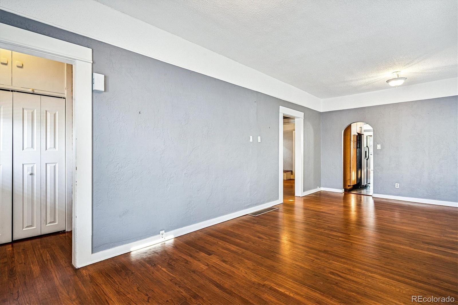 354 North Washington Street Denver, CO 80203 - Photo 8 of 43 a view of an empty room with wooden floor