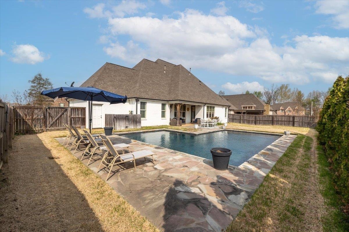 608 Cypress Run Cove Collierville, TN 38017 - Photo 3 of 40 View of pool with patio surround, a fenced backyard, and a gate