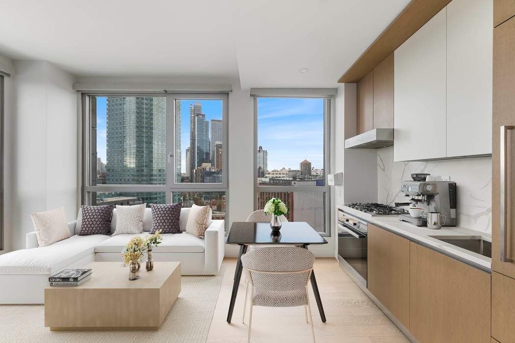 22-43 Jackson Avenue, Unit 11F Queens, NY 11101 - Photo 10 of 18 a living room with furniture and a large window