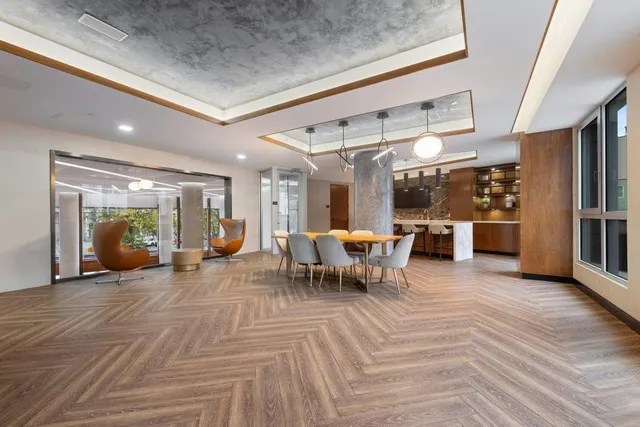 a balcony with furniture and a potted plant