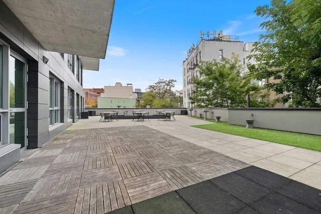 a living room with lots of table and chairs