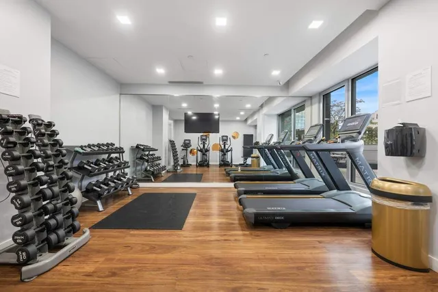 a bedroom with furniture and a baby crib