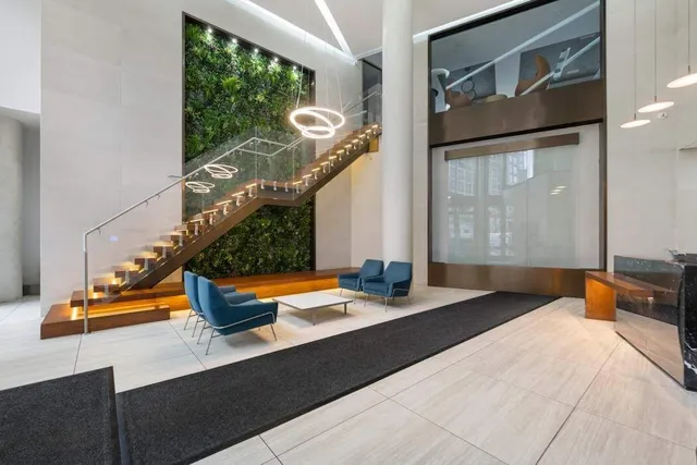 a living room with lots of furniture and wooden floor