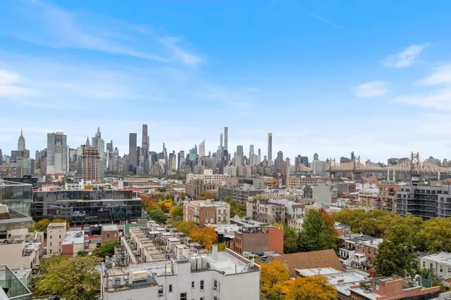 a view of a brick house with a large window