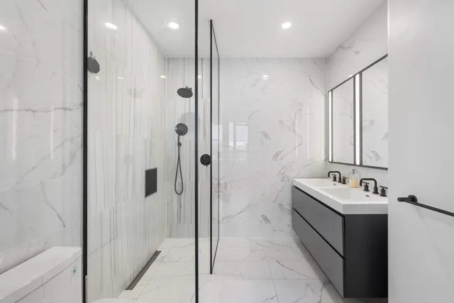 a bathroom with a granite countertop sink