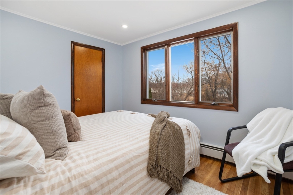 47 School Street Saugus, MA 01906 - Photo 11 of 30 a bedroom with a bed and wooden floor