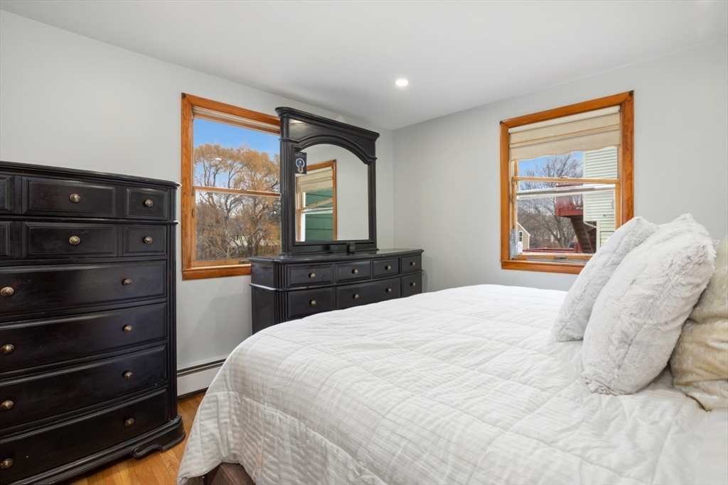 47 School Street Saugus, MA 01906 - Photo 15 of 30 a bedroom with a bed and a large window