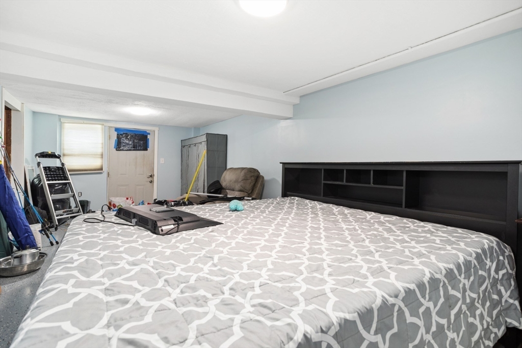 47 School Street Saugus, MA 01906 - Photo 19 of 30 a bedroom with a bed and a dresser