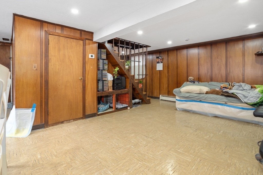 47 School Street Saugus, MA 01906 - Photo 21 of 30 a bedroom with a bed and a closet