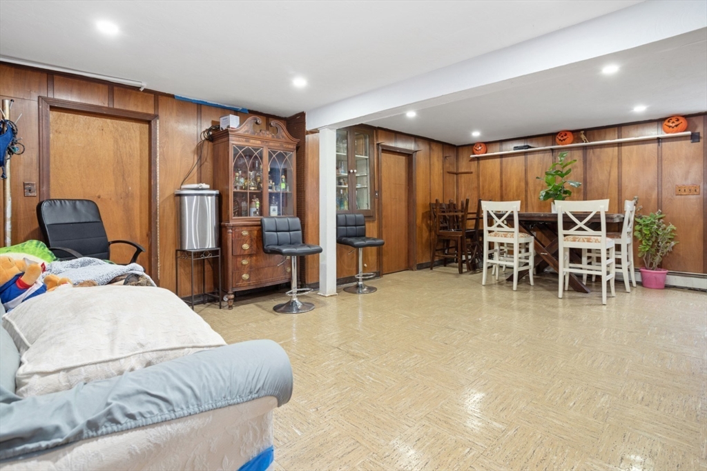 47 School Street Saugus, MA 01906 - Photo 22 of 30 a living room with furniture a ceiling fan and a wooden floor