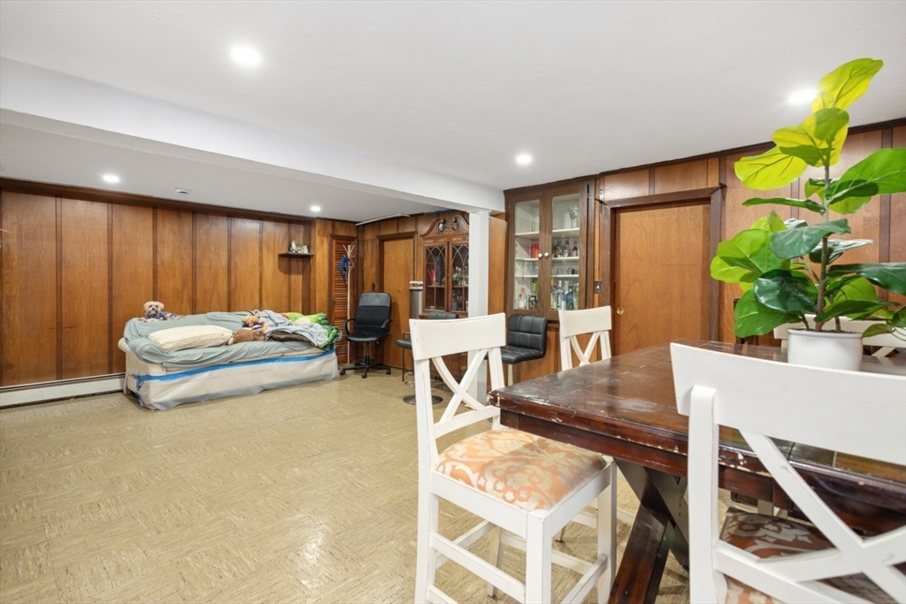 47 School Street Saugus, MA 01906 - Photo 25 of 30 a living room with furniture and a potted plant