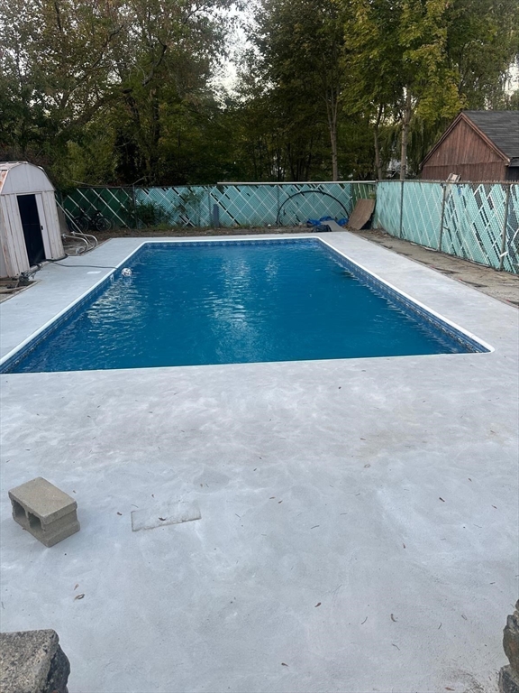 47 School Street Saugus, MA 01906 - Photo 28 of 30 a view of backyard with swimming pool