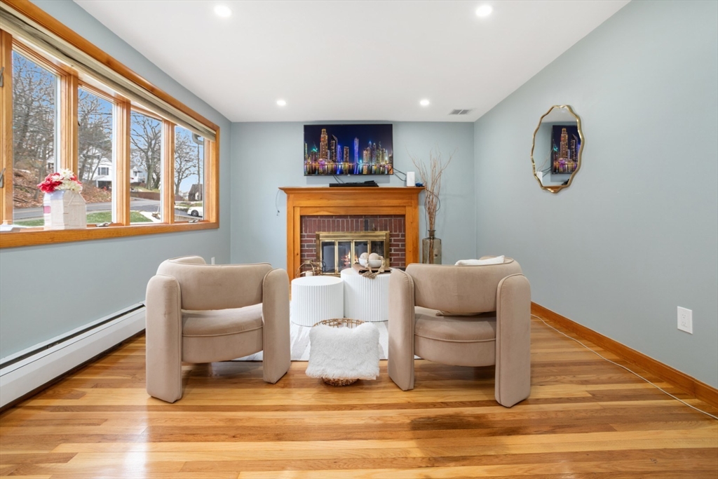 47 School Street Saugus, MA 01906 - Photo 5 of 30 a living room with furniture and a fireplace