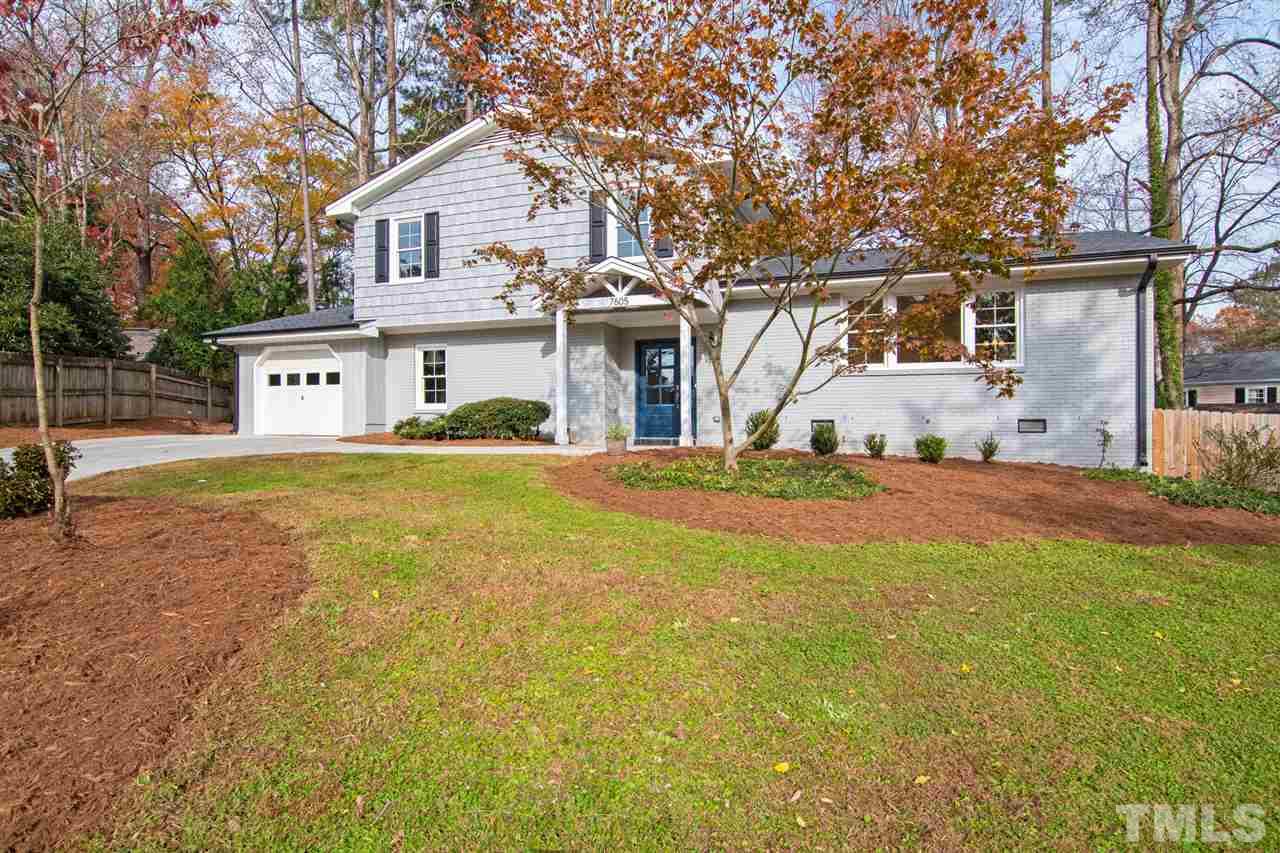 7605 Starling Court Raleigh, NC 27615 - Photo 2 of 30 a view of a house with a big yard and large trees
