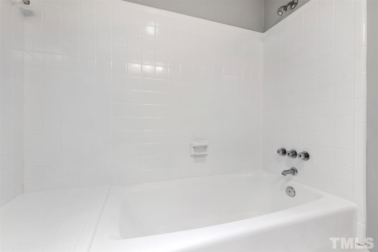7605 Starling Court Raleigh, NC 27615 - Photo 24 of 30 a bathroom with a bathtub