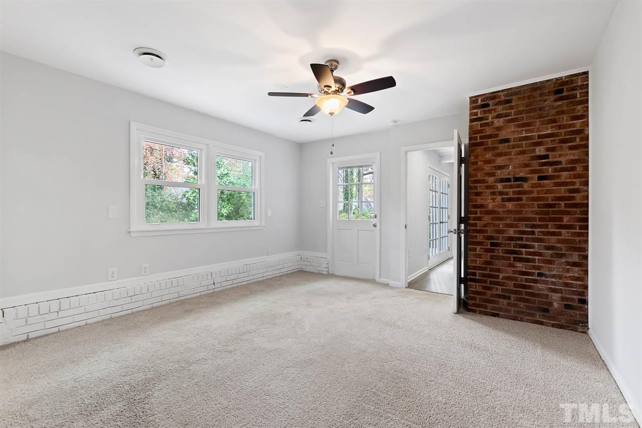 7605 Starling Court Raleigh, NC 27615 - Photo 25 of 30 wooden floor in an empty room with a window