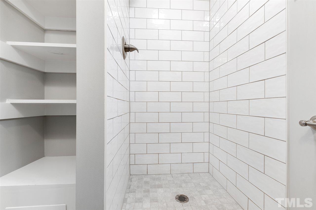 7605 Starling Court Raleigh, NC 27615 - Photo 26 of 30 a bathroom with a shower