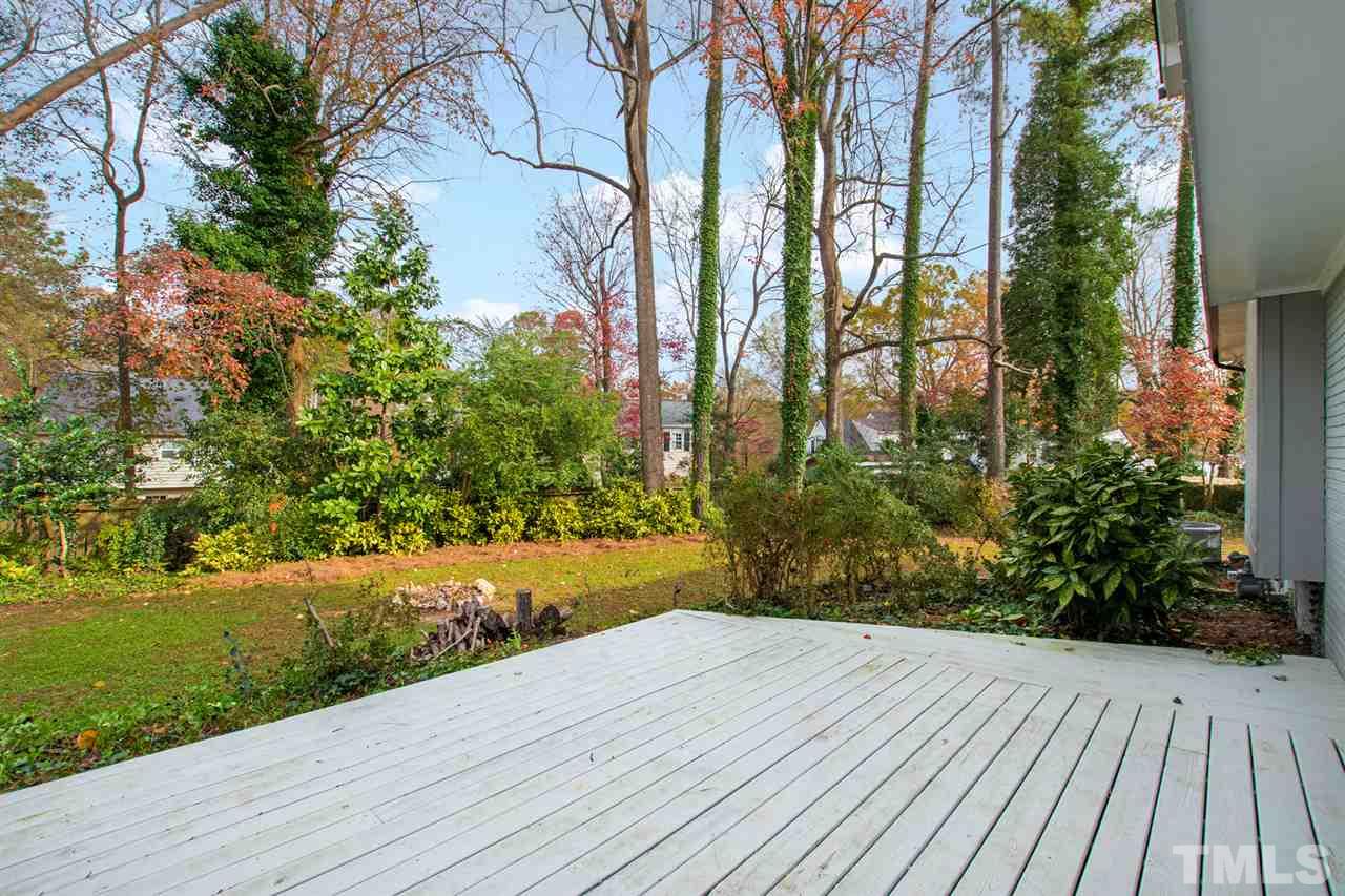 7605 Starling Court Raleigh, NC 27615 - Photo 29 of 30 a view of hardwood floor and a yard with wooden fence