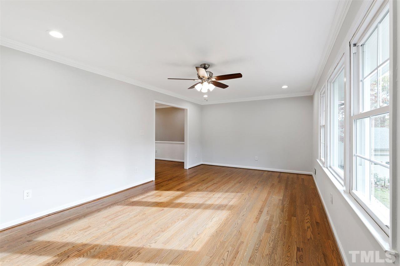 7605 Starling Court Raleigh, NC 27615 - Photo 5 of 30 wooden floor in an empty room with a window