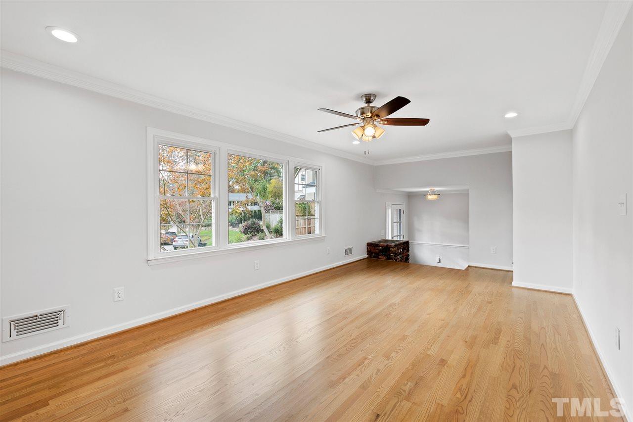 7605 Starling Court Raleigh, NC 27615 - Photo 7 of 30 wooden floor in an empty room with a window