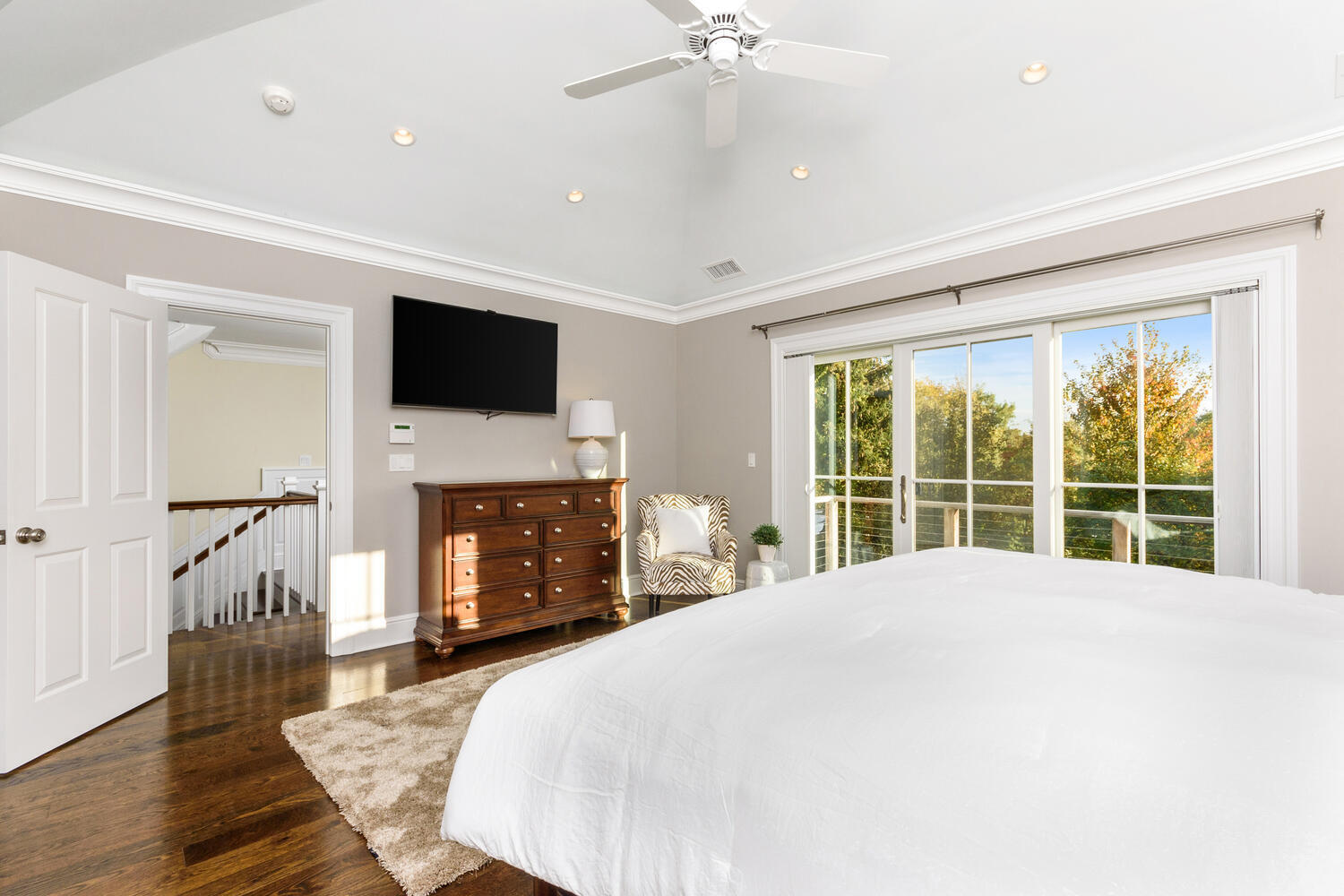 178 Middlesex Road Darien, CT 06820 - Photo 21 of 44 a large bedroom with a bed and a flat screen tv