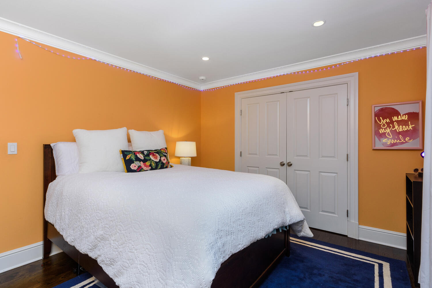 178 Middlesex Road Darien, CT 06820 - Photo 26 of 44 a bedroom with a bed and wooden floor