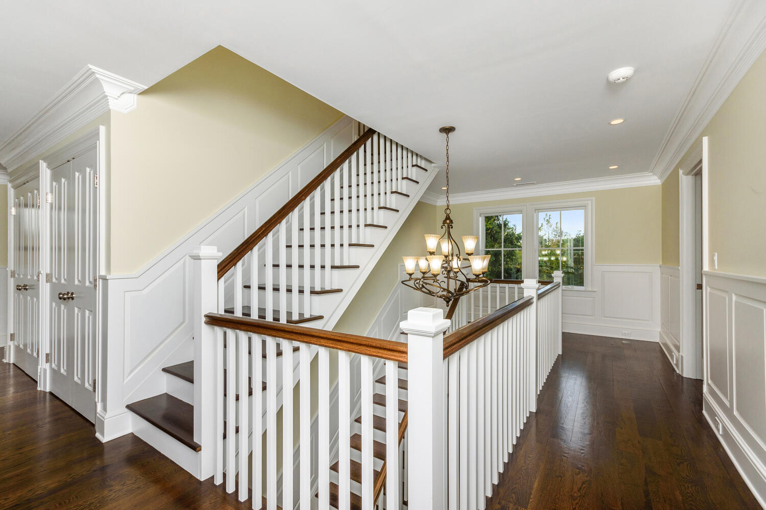 178 Middlesex Road Darien, CT 06820 - Photo 31 of 44 a view of staircase with wooden floor and a front door