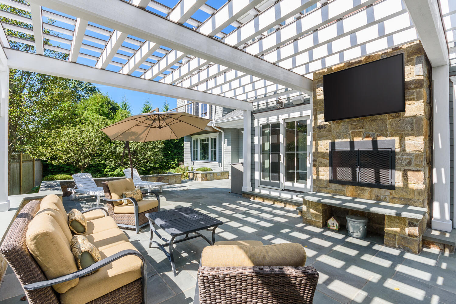 178 Middlesex Road Darien, CT 06820 - Photo 38 of 44 a outdoor living space with furniture and a fireplace