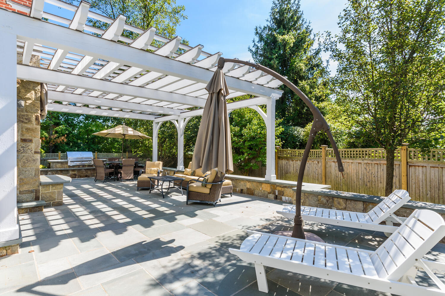 178 Middlesex Road Darien, CT 06820 - Photo 39 of 44 a view of a patio with couches chairs and wooden floor