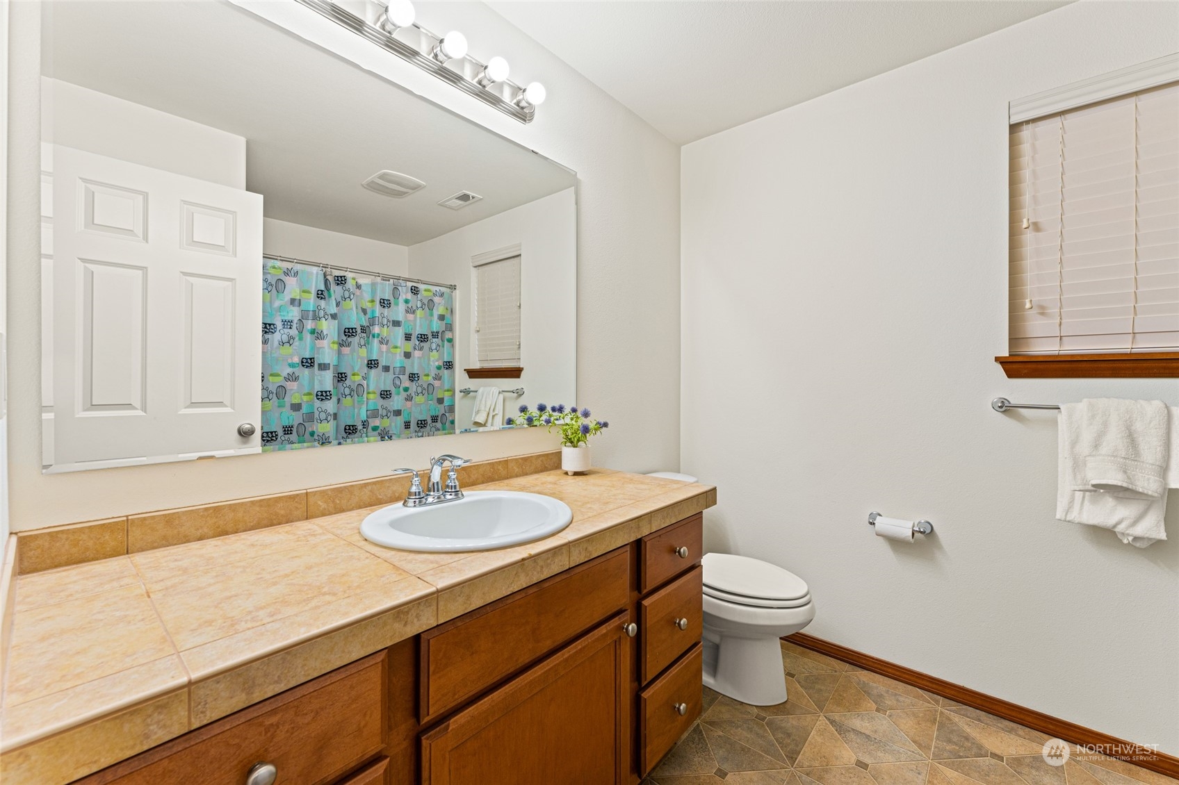 22907 41st Drive Southeast Bothell, WA 98021 - Photo 26 of 39 a bathroom with a sink a toilet and a mirror