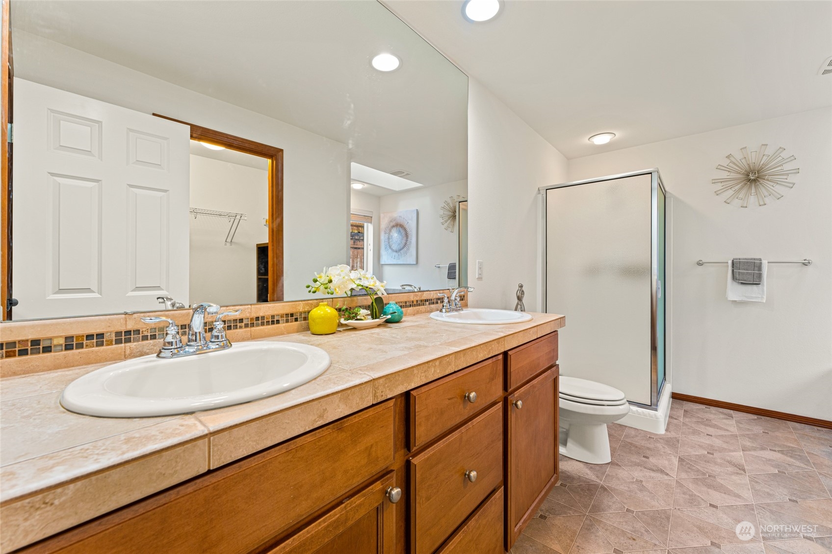 22907 41st Drive Southeast Bothell, WA 98021 - Photo 32 of 39 a bathroom with a granite countertop sink and a mirror