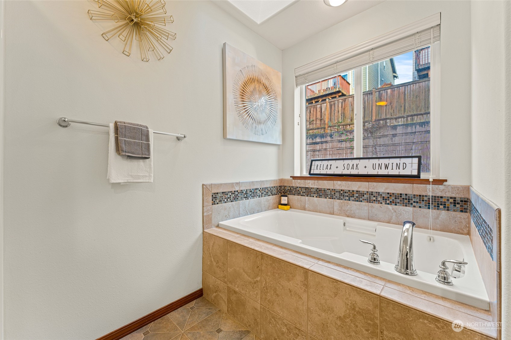 22907 41st Drive Southeast Bothell, WA 98021 - Photo 33 of 39 a bathroom with a tub a sink and a window