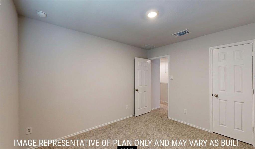 10313 Neptune Court Waco, TX 76708 - Photo 15 of 17 Carpeted room with light neutral wall paint