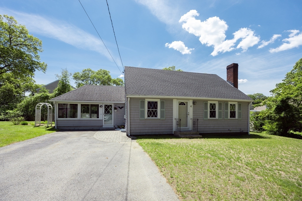 4 Cypress Road Natick, MA 01760 - Photo 1 of 32 a front view of a house with a yard