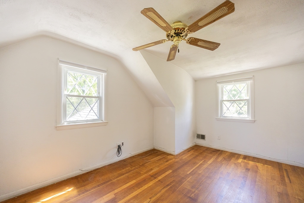 4 Cypress Road Natick, MA 01760 - Photo 30 of 32 a view of a room with a window and wooden floor