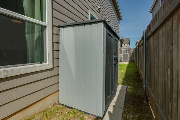 a bathroom with a shower and a sink