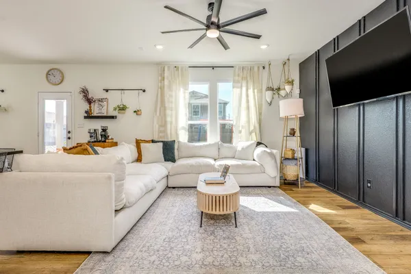 a living room with furniture and a flat screen tv