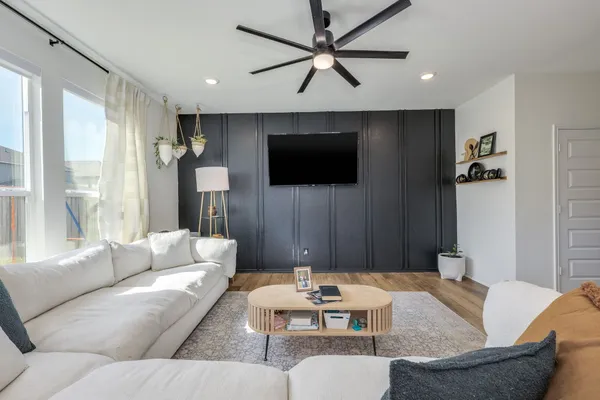 a living room with furniture and a flat screen tv